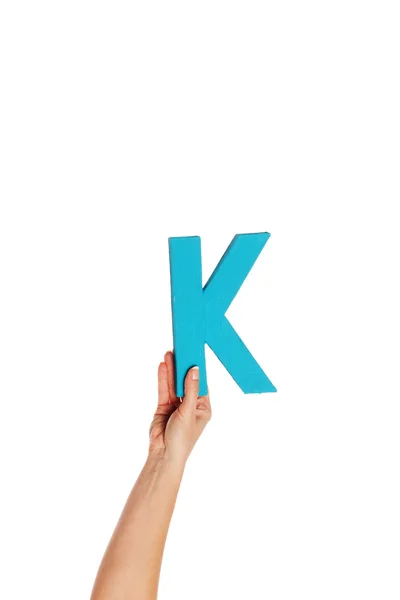 Hand holding up the letter K from the bottom — Stock Photo, Image