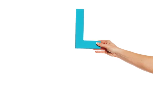 Hand holding up the letter B from the right — Stock Photo, Image