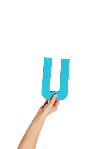 Hand som håller upp den bokstav u från botten — Stockfoto