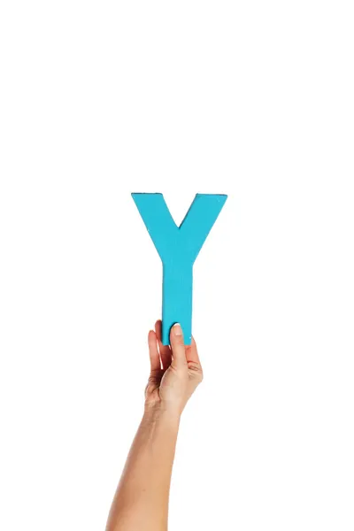 Hand som håller upp bokstaven y från botten — Stockfoto