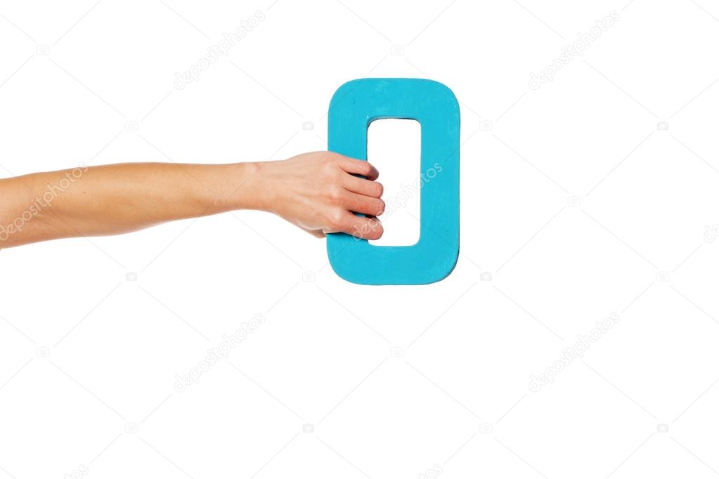 hand holding up the number zero from the left