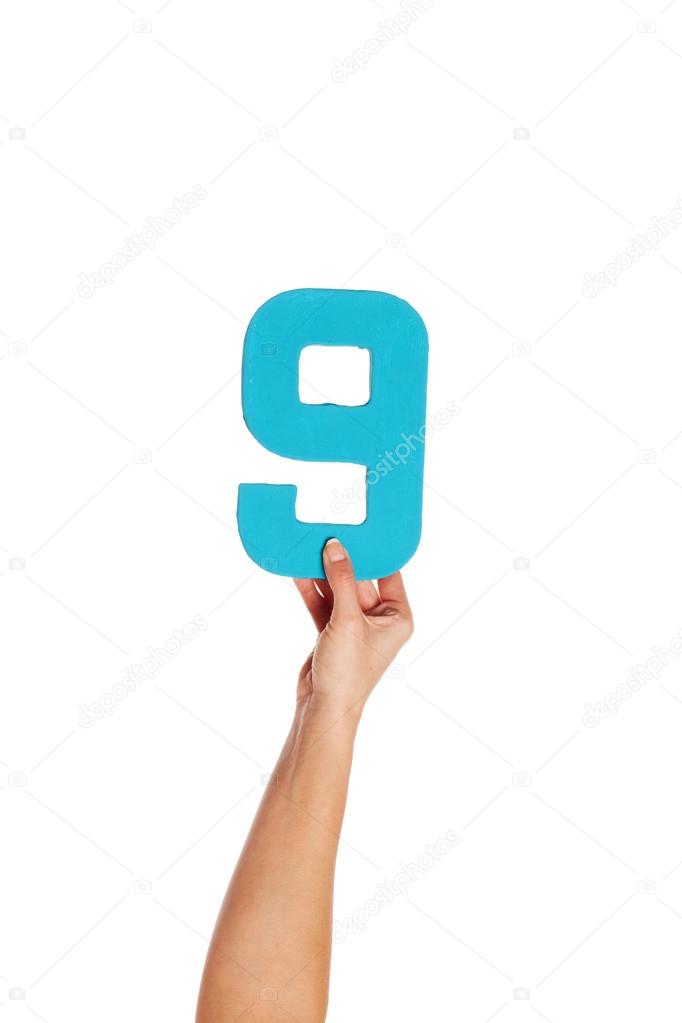 hand holding up the number nine from the bottom