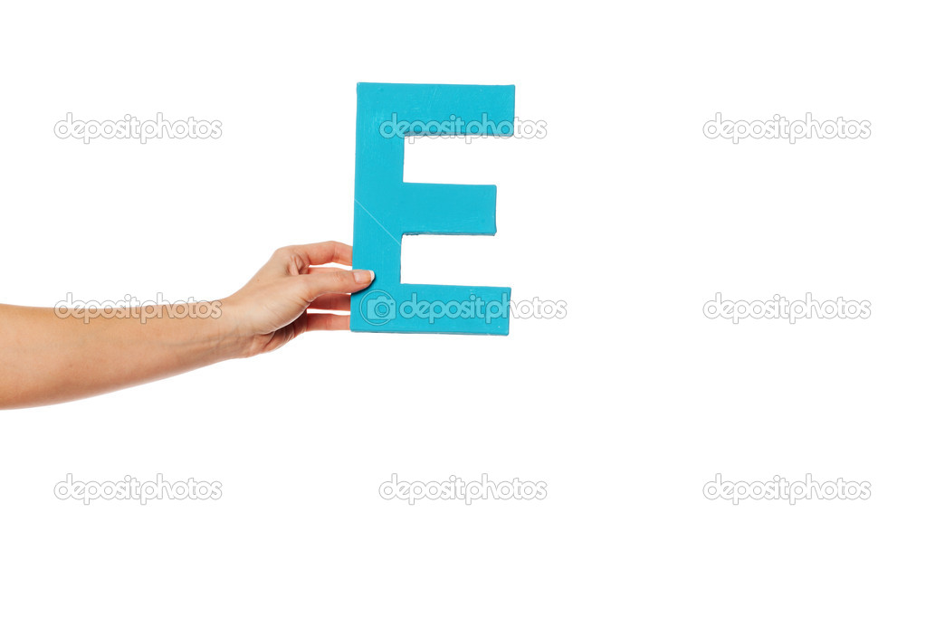 hand holding up the letter E from the left