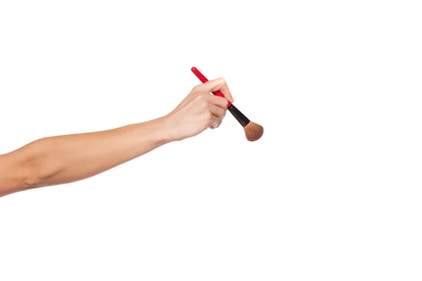 Ženská ruka drží make-up štětce — Stock fotografie