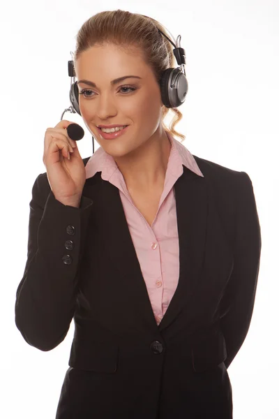 Schöne Geschäftsfrau spricht auf einem Headset — Stockfoto