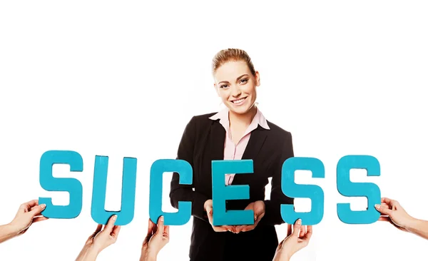 Affärskvinna med ordet framgång — Stockfoto