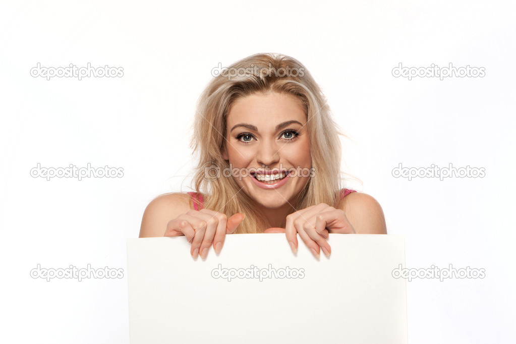 Happy blonde woman with blank sign