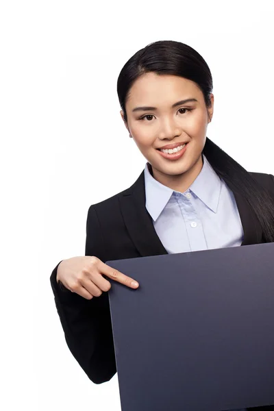 Asiática mujer de negocios apuntando a un tablero —  Fotos de Stock