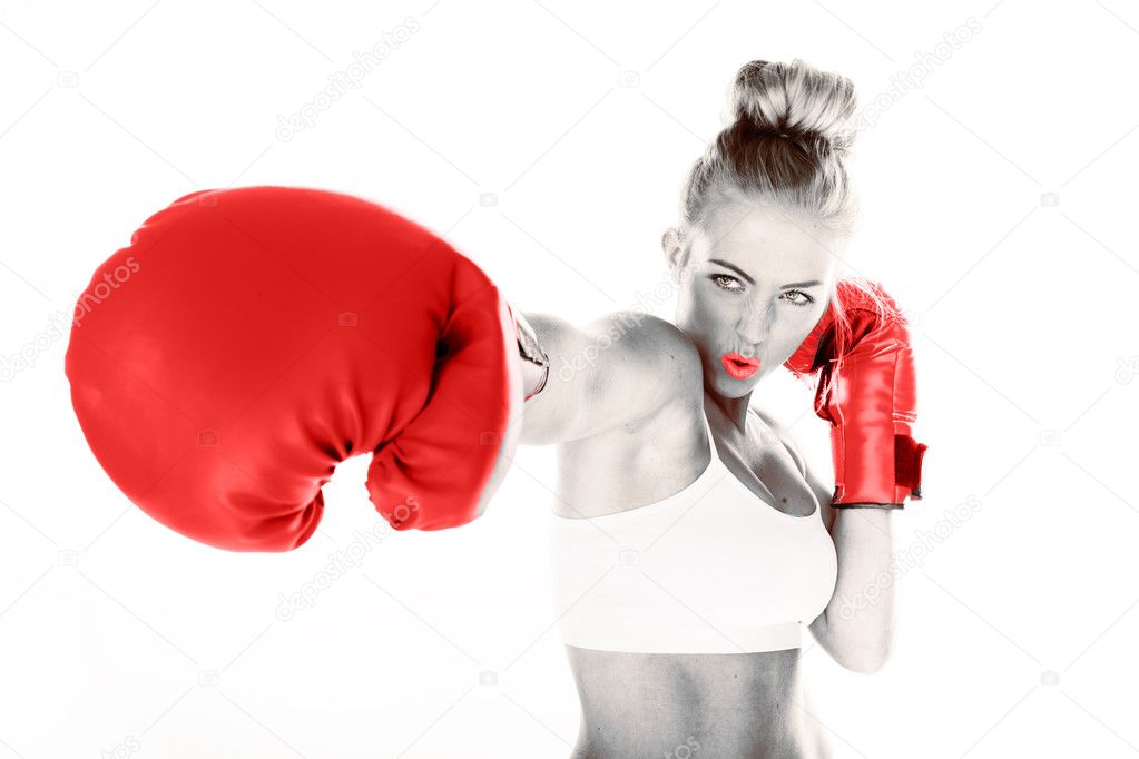 Sexy woman delivering a punch