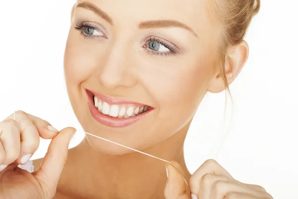 Blonde looking after teeth — Stock Photo, Image
