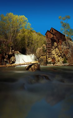 Building by the river in Crystal Mill Ghost town clipart