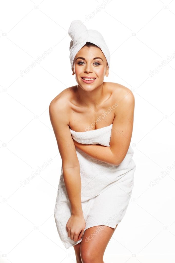 Sexy and shy woman getting out of the bath