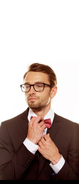 Man straightening his bow tie — Stock Photo, Image