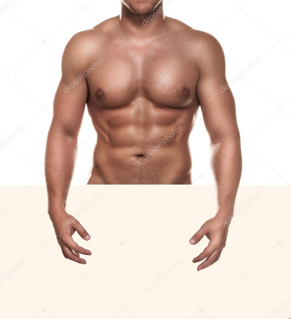 Naked muscular man covering with a copy space blank sign isolated on white