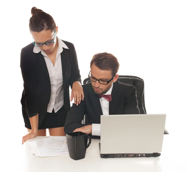 Business couple in front of the desk — Stock Photo, Image