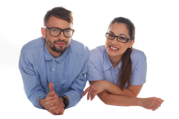 Nerdy looking couple looking at camera — Stock Photo, Image