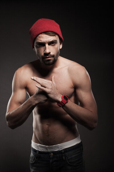 Young fit man in a menacing attitude