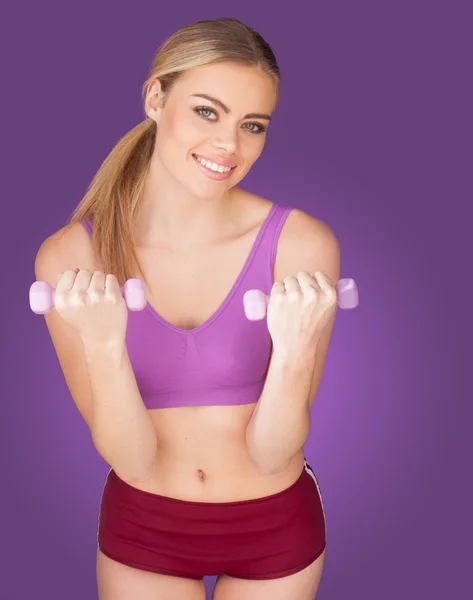 Mujer atractiva haciendo ejercicio con mancuerna —  Fotos de Stock