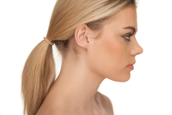 Profile portrait of a serious blond woman — Stock Photo, Image