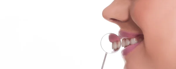 Smiling woman with a dental mirror — Stock Photo, Image