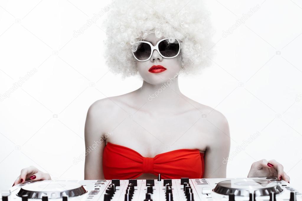 Portrait of a cool sexy female DJ, on white