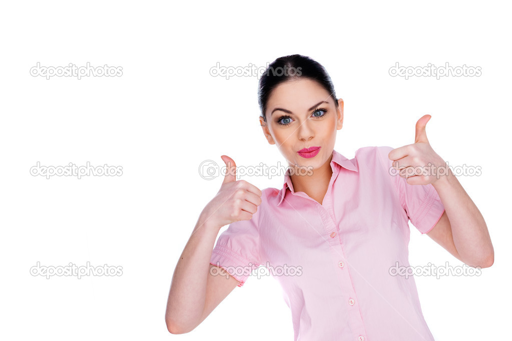 Enthusiastic young woman giving a thumbs up