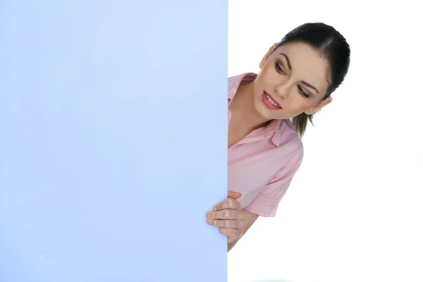 Hermosa mujer señalando un signo en blanco — Foto de Stock