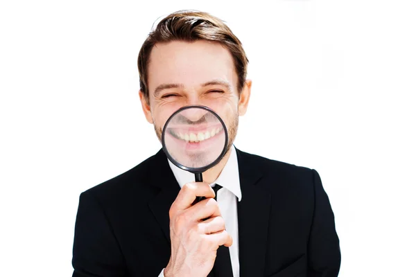 Businessman with a magnified smile — Stock Photo, Image