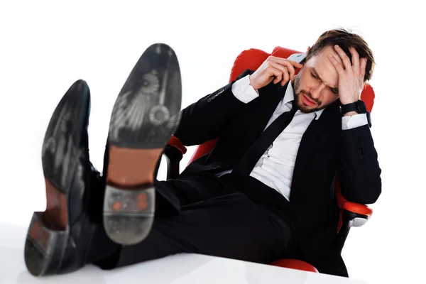 Worried businessman chatting on his mobile — Stock Photo, Image