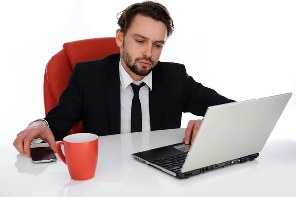 Young businessman working on his laptop — Stock Photo, Image