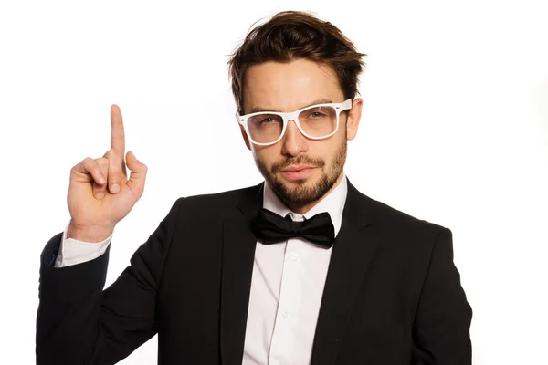 Coll looking businessman pointing up — Stock Photo, Image