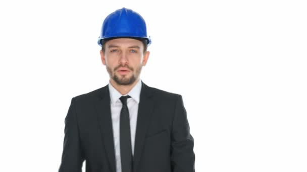 Man wearing a hardhat speaking into a megaphone — Stock Video