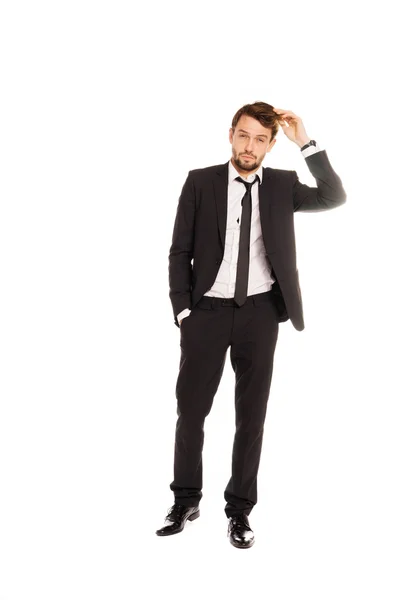 Businessman scratching his head in doubt — Stock Photo, Image