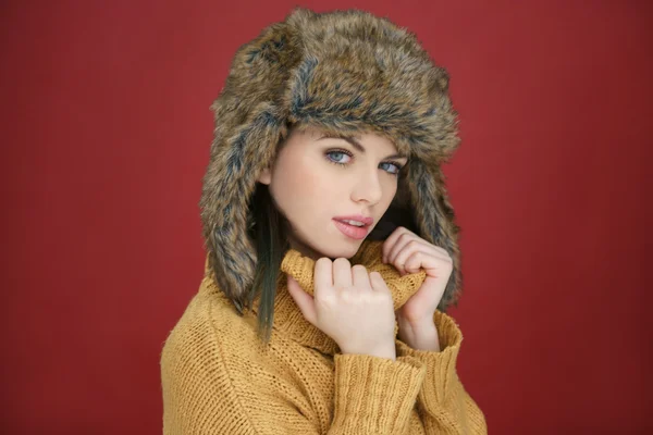 Beautiful sexy woman in a winter fur hat — Stock Photo, Image