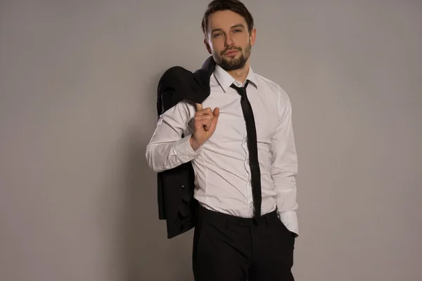 Handsome businessman loosening his tie — Stock Photo, Image