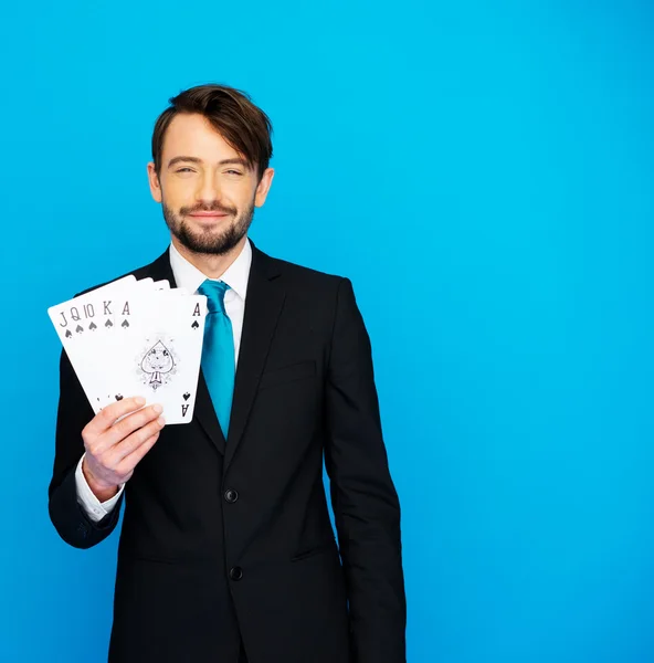 Young business man showing playing cards — Stock Photo, Image