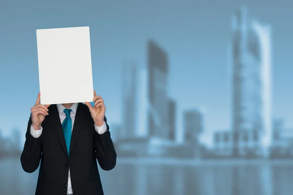 Businessman holding blank poster — Stock Photo, Image