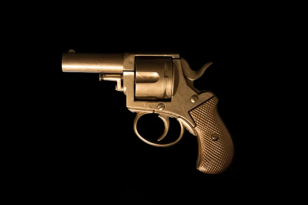 Old hand gun on a dark background — Stock Photo, Image