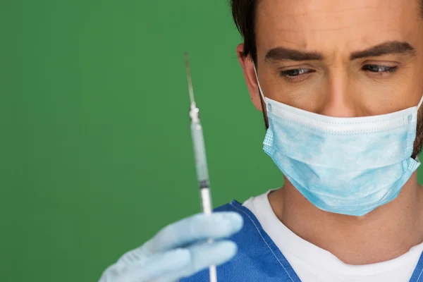 Doctor or male nurse with a hypodermic — Stock Photo, Image