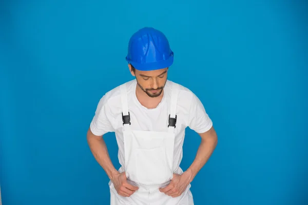 Workman in a blue hardhat — Stock Photo, Image