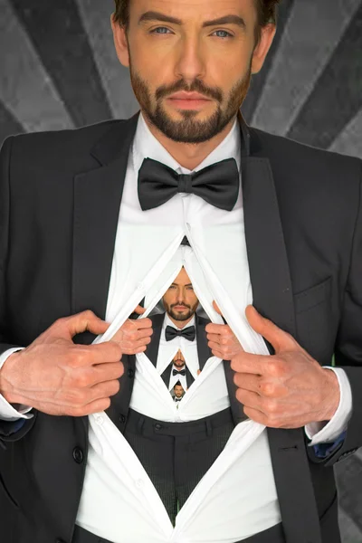 Handsome man in a bow tie baring his chest — Stock Photo, Image