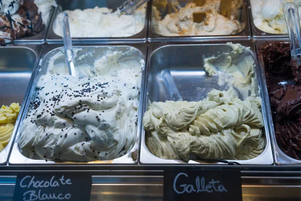 Italian ice cream on display in metal tubs — Stock Photo, Image