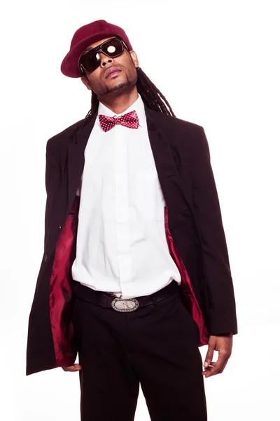 Jamaican man wearing suit and sunglasses and bow — Stock Photo, Image