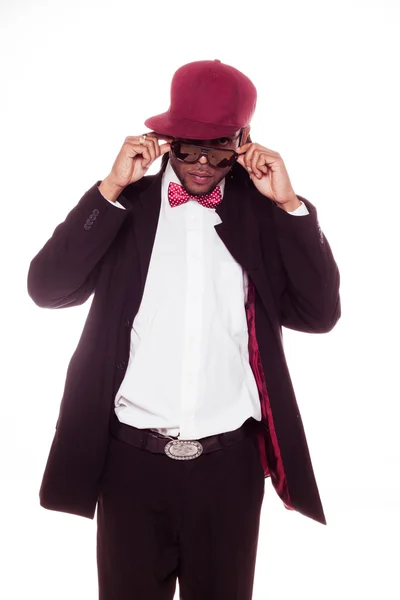 Trendy young man in a burgundy cap and bow tie — Stock Photo, Image