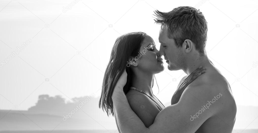 Attractive young couple enjoying a romantic kiss