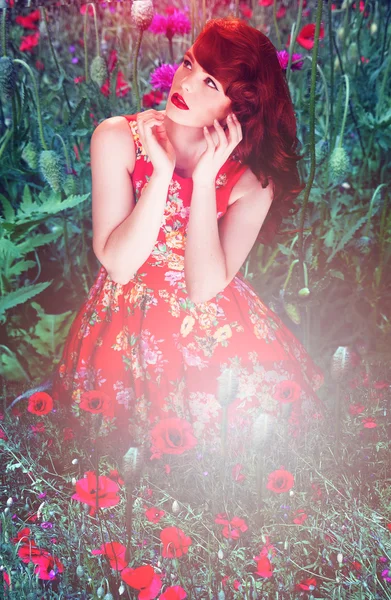 Artistic portrait of a woman amongst red poppies — Stock Photo, Image