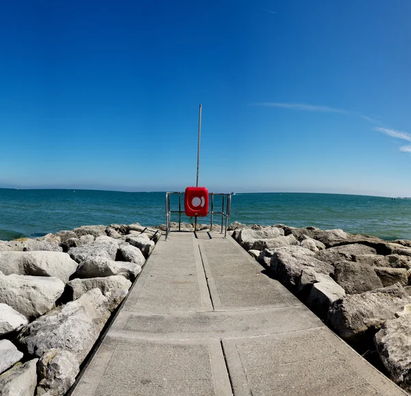 Deserted stone pier or seawall — Stock Photo, Image