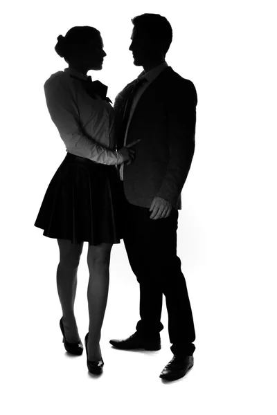 Loving young couple in silhouette — Stock Photo, Image