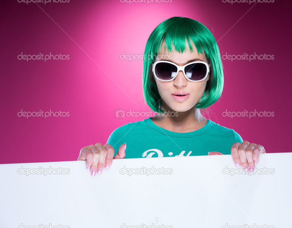 Young woman with a colorful green hairstyle