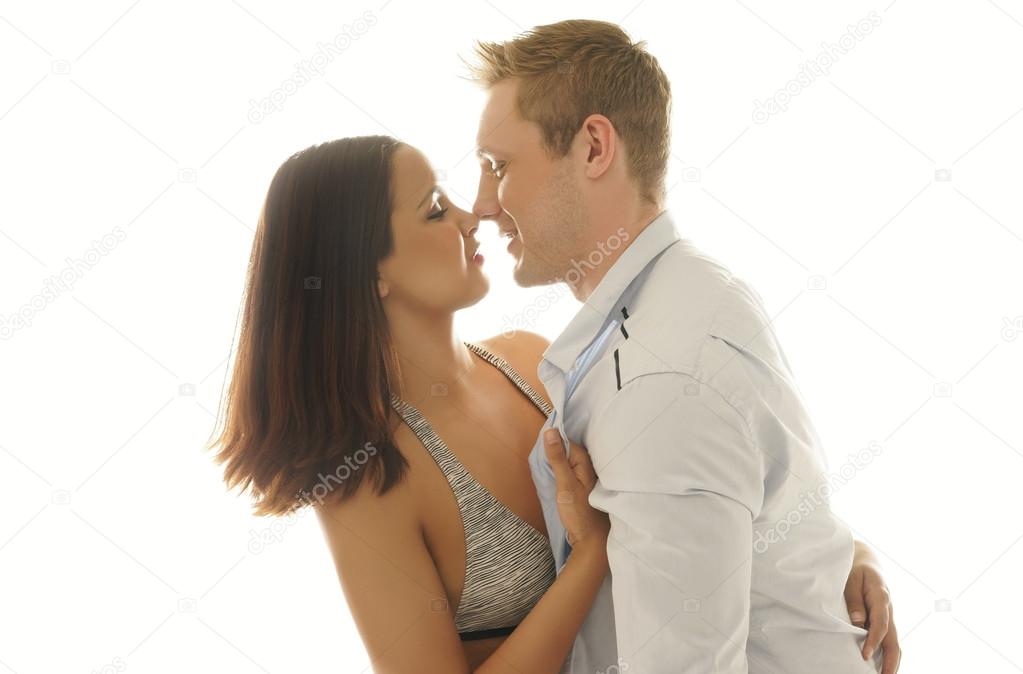 Loving young man kissing his girlfriend